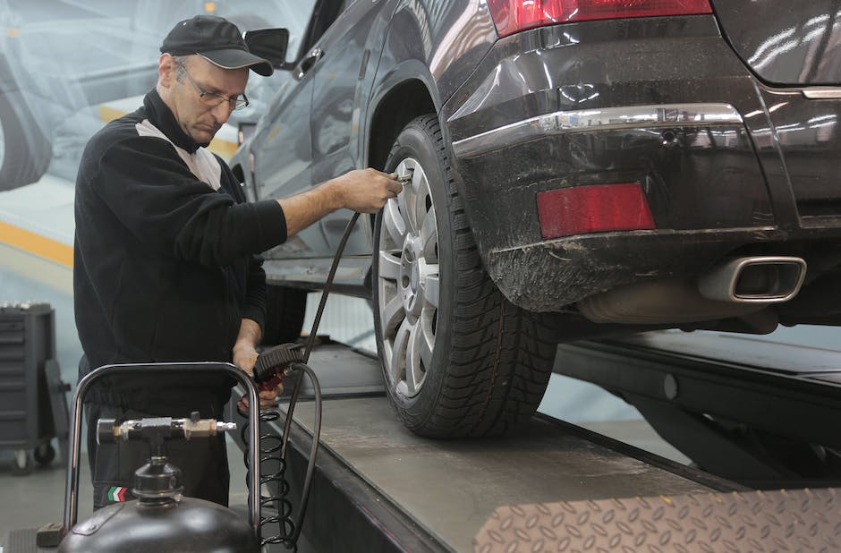 Illustration of a person inspecting a car's electrical system. Understanding Common Problems with Older Jeep Cherokee Models